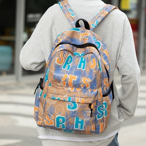Detailed view of casual nylon backpack with street graffiti prints and padded straps