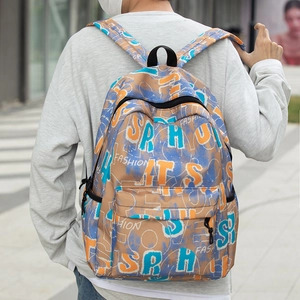 Detail of backpack showing graffiti print and durable side pockets with street style