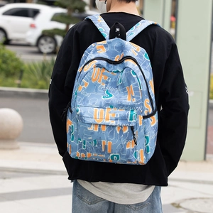 Outdoor shot of the gray-blue street style graffiti backpack with fashion print design