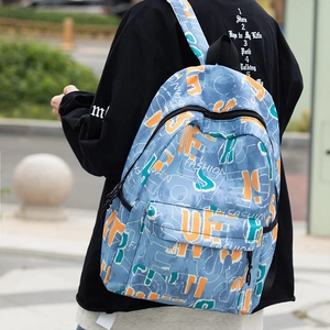 Outdoor view of casual backpack with colorful graffiti prints and fashion lettering