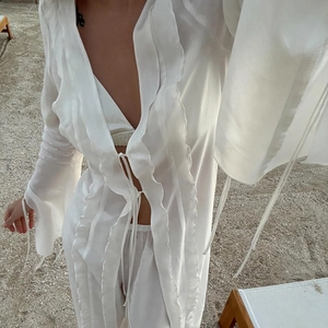 Ensemble de plage blanc 3 pièces avec robe à volants et pantalon transparent femme