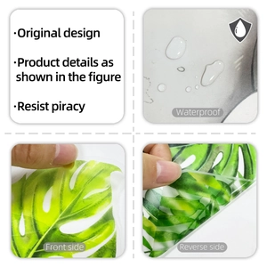 Detail of waterproof monstera leaf wall decal showing translucent texture and adhesive layer