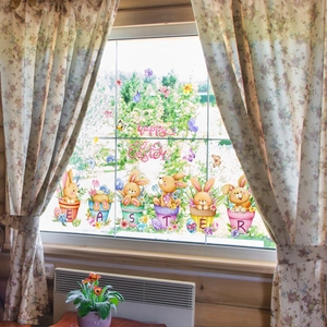 Easter bunny window decals in colorful flower pots shown on a bright home window