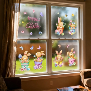 Close-up of Happy Easter window stickers with watercolor rabbits and colorful eggs