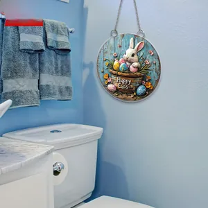 Close-up of 2D flat Easter bunny round plaque with silver hanging chain on wall