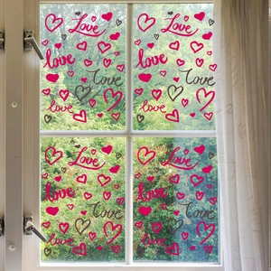 Close-up of heart and Love patterns on static window stickers for romantic home decor