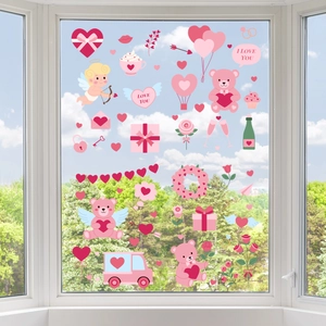 Close-up of Valentine stickers on window featuring pink hearts and romantic elements