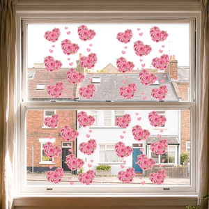 Detail of pink floral heart-shaped static window stickers with romantic rose pattern