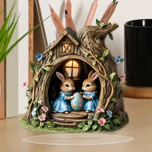 Detailed 2D acrylic Easter bunny tree house ornament with transparent base on desk