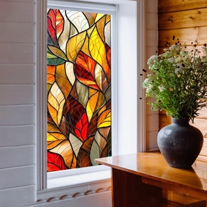 Artistic stained glass window film featuring autumn leaf patterns and warm colors