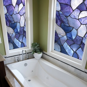 Macro shot of purple and blue mosaic static window film on bathroom glass for privacy