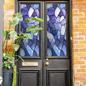 Detail of colorful geometric static window film on glass door with wave texture