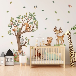 Detail of forest animal wall stickers featuring watercolor deer and owl in a nursery