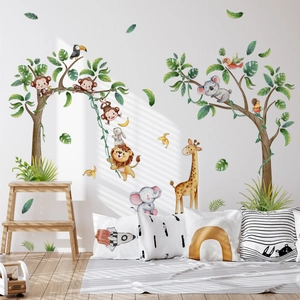 Detail of watercolor jungle animals wall decals with monkeys and giraffe in a nursery