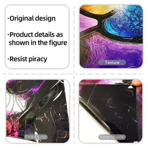 Detail of colorful irregular square window film showing glossy 3D texture and adhesive backing