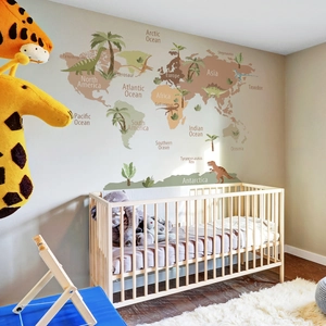 Educational dinosaur world map wall decal shown in a modern nursery setting decor