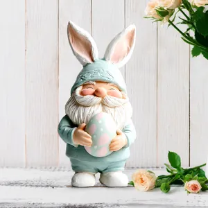 Close-up of 2D acrylic Easter gnome with rabbit ears and egg on a flat stand