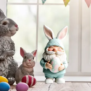Detailed view of 2D flat acrylic gnome decoration with bunny ears and pink Easter egg