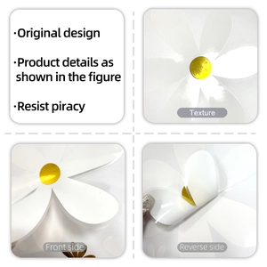 Macro detail of white daisy wall stickers showing golden foil texture and adhesive back