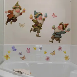 Detail of Easter gnome wall stickers with floral eggs and butterflies on bathroom tiles