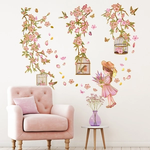 Pink floral wall decals featuring a girl and birdcages for living room decor