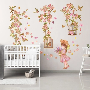 Detail of pink floral wall sticker with a girl, birdcage, and butterflies for a nursery room