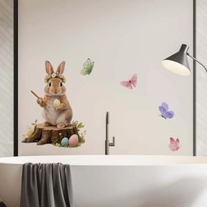 Detailed view of Easter bunny with flower wreath and butterfly wall stickers on bathroom wall