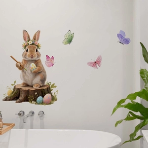 Easter bunny wall sticker detail with floral eggs and butterflies on a white bathroom wall