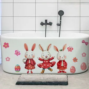 Close-up of Easter bunny and egg stickers applied to a white bathtub surface