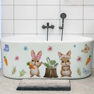 Detailed view of Easter rabbit and flower wall decals applied on a white bathtub side