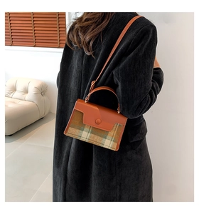 Retro plaid tweed handbag featuring brown faux leather trim and elegant circular buckle detail