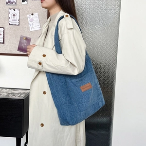 Blue denim tote bag for women with large capacity and stylish wide shoulder strap