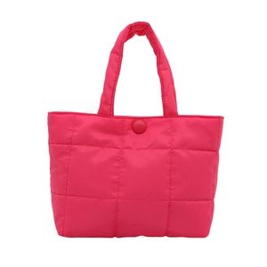 Stylish rose red quilted tote bag with large square stitching and woven handles