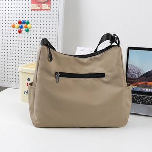 Khaki large capacity crossbody bag with multiple pockets and adjustable strap