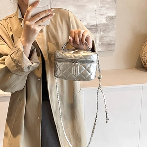 Silver quilted mini crossbody bag with metallic finish and chain strap for women