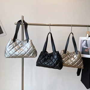 Padded quilted puffer tote bags in metallic silver black and gold with leather straps
