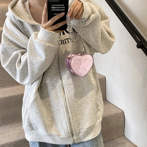 Pink heart-shaped mini crossbody bag in mirror patent leather with silver chain strap