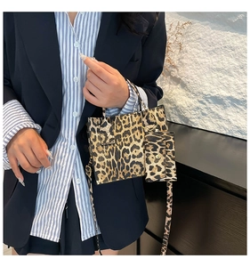 Detail of leopard print handbag with matching coin purse and detachable shoulder strap