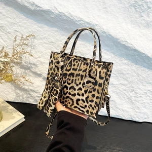 Chic leopard print handbag set with a small matching pouch and detachable shoulder strap