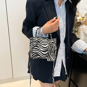 Fashionable zebra print shoulder bag with matching coin purse and crossbody strap for women