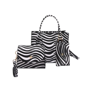 Three-piece French style zebra stripe handbag set including tote, crossbody and coin purse