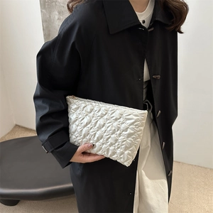 Chic silver quilted clutch bag for women with metallic finish and zipper closure