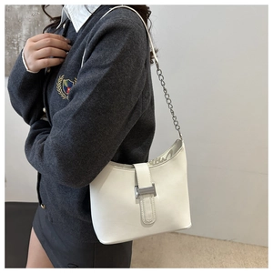 White hobo shoulder bag featuring a silver chunky chain strap and metal buckle detail