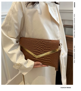 Brown crocodile pattern envelope clutch with gold V-metal decor and wrist strap detail
