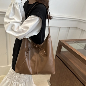 Brown leather tote bag with bow tie detail for women, casual vintage shoulder bag style