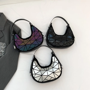 Minimalist geometric crescent underarm bag with glossy triangle pattern in three colors