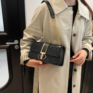 Retro crocodile pattern crossbody bag with golden twist lock and chain strap on a model