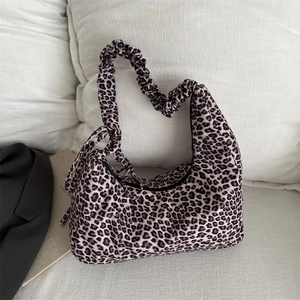 Chic leopard print hobo bag with pleated shoulder strap for autumn winter fashion look