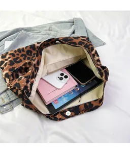 Top view of large leopard print canvas tote bag interior with zipper pocket and magnetic buckle