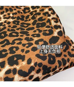 Close-up of leopard print canvas fabric showing high-quality twill weave texture